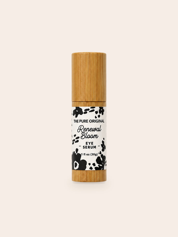 Renewal Bloom Eye Serum: slim wood-grain roller tube, white label band with black flowers