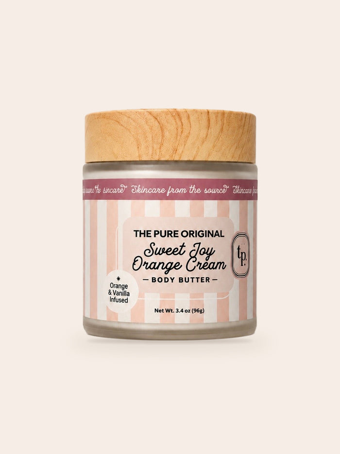 Sweet Joy Orange Cream body butter: frosted jar, wood-grain lid, blush pink and white striped label