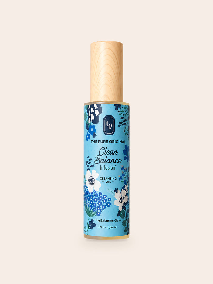 Clear Balance Cleansing Oil: tall bottle, wood-grain cap, turquoise floral label reading Clear Balance in script